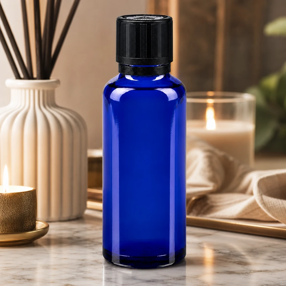 30 ml blå dråbeflaske af apotekerglas med sort originalprop og 1 mm indsats