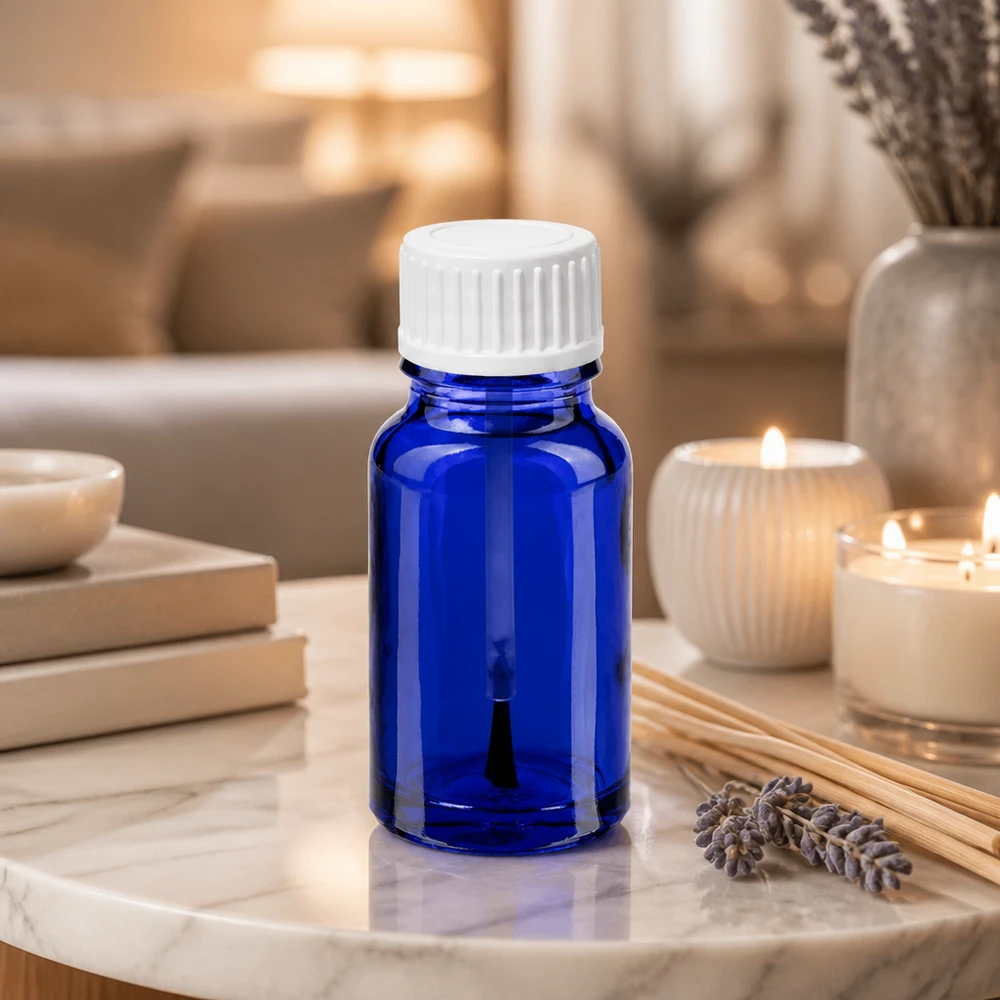 Blå 10 ml glasflaske med integreret børste til punktbehandlinger og aromaterapi