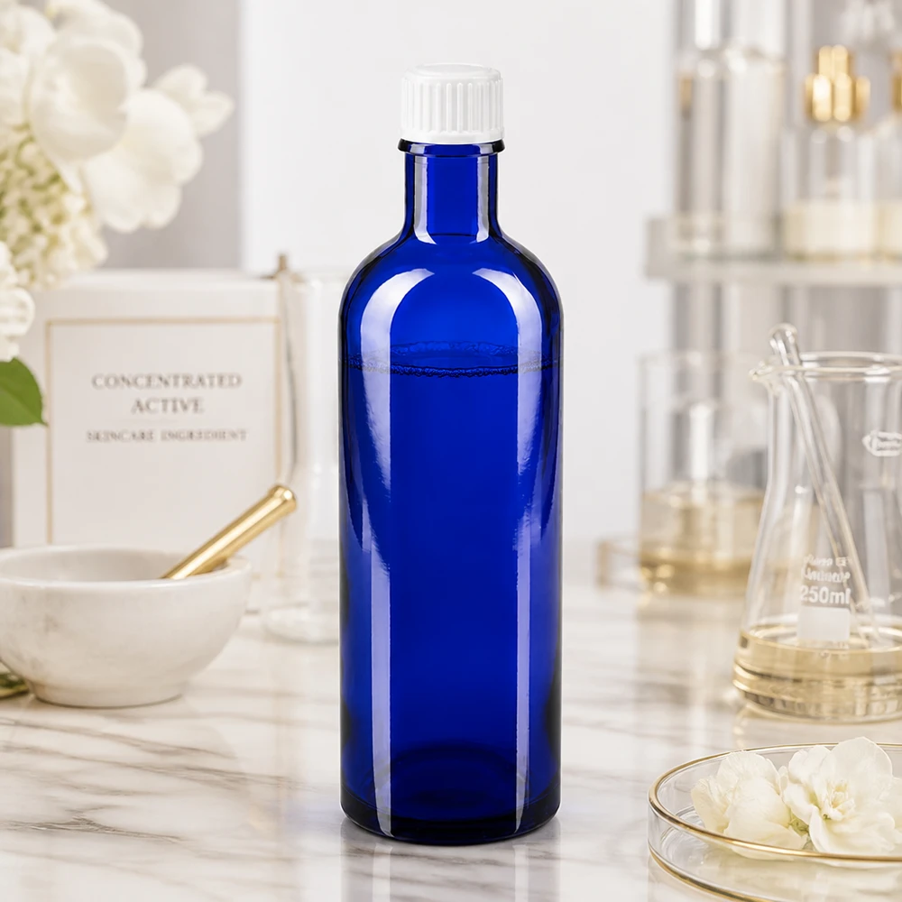 Apoteksflaske blå 200 ml skruelåg hvid pc Koboltblå apotekerflaske på 200 ml med UV-beskyttelse, fremstillet af borosilikatglas og med hvid prop