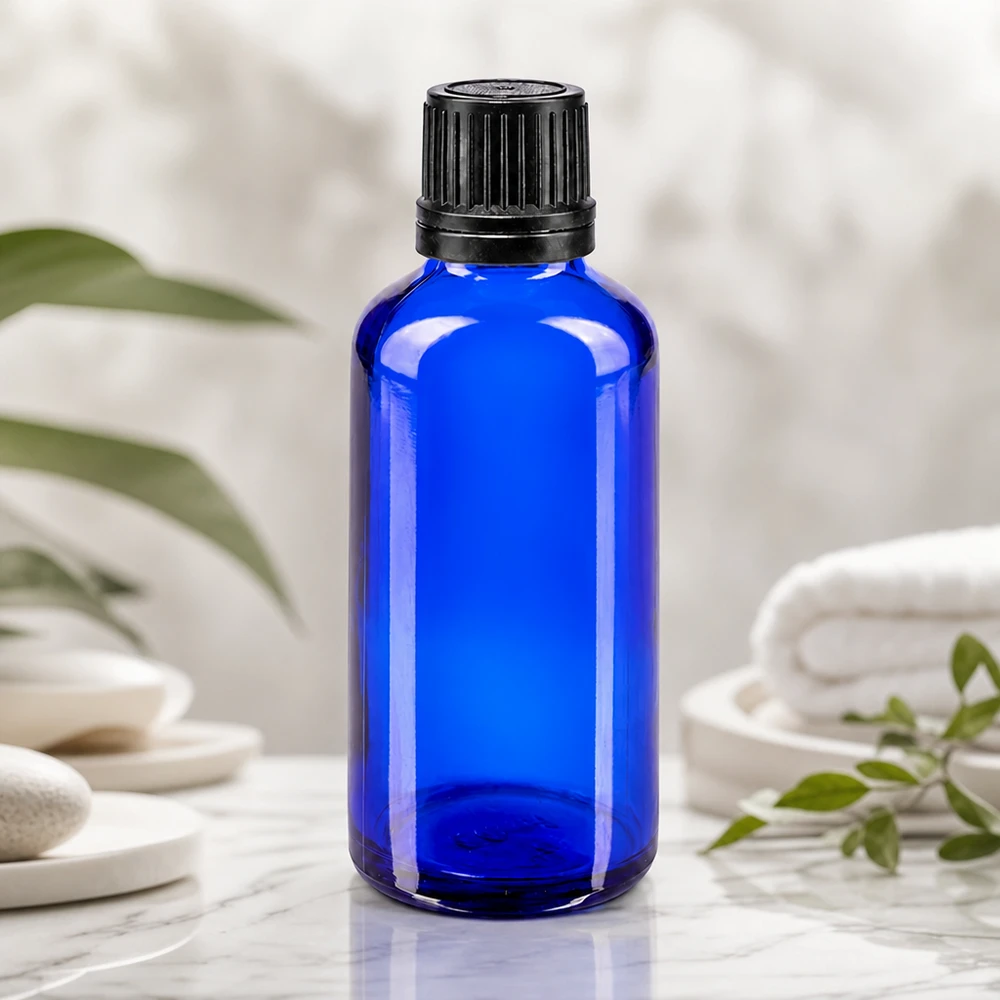 Blå 50 ml dråbeflaske med 1 mm dråbeindsats til præcis dosering af æteriske olier