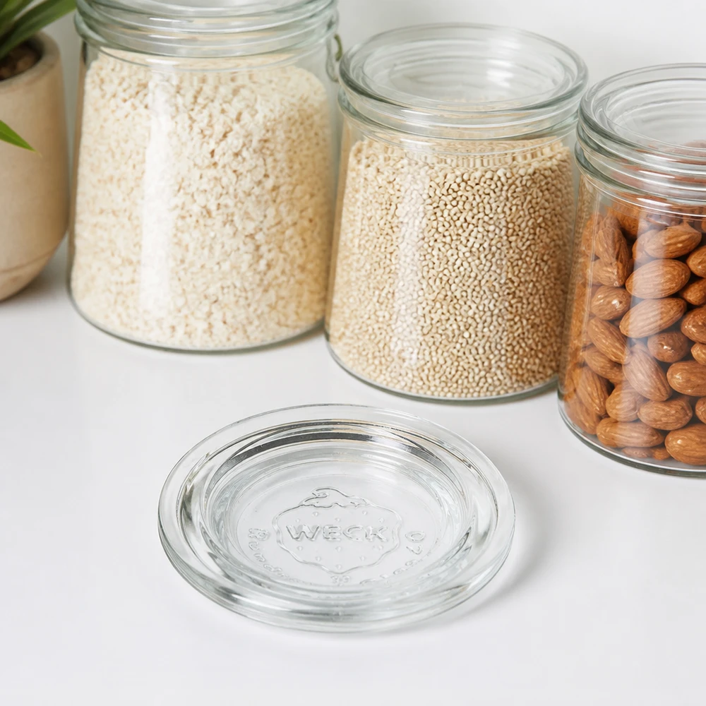 WECK glaslåg RR40 WECK glaslåg RR40 transparent foran opbevaringskrukker med ris, quinoa og nødder på en hvid bordplade