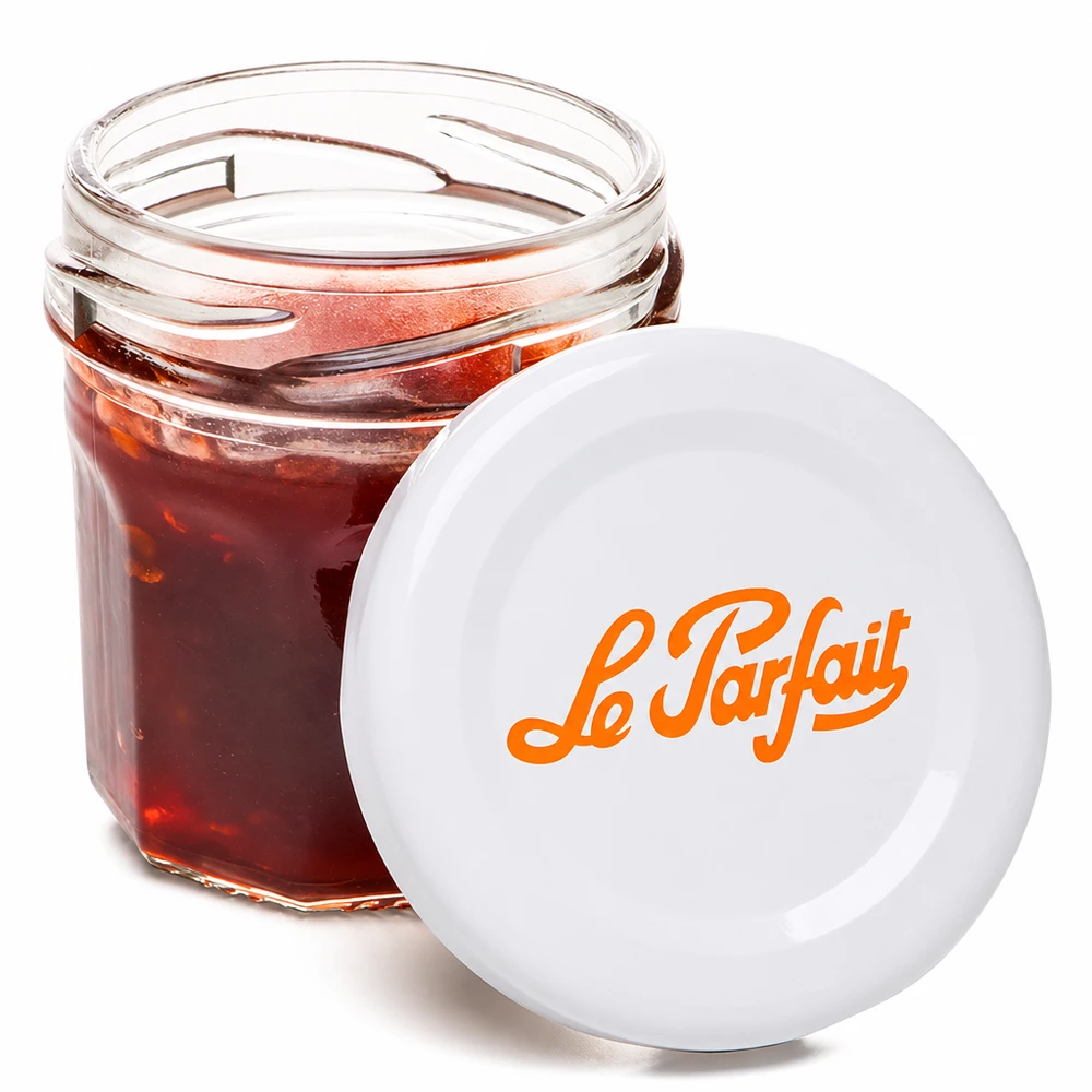 Le Parfait® Mini‑Jam 44 ml Ø48 mm glas Le Parfait minikrukke 44 ml åbnet fyldt med rød marmelade og orange logo på hvidt låg