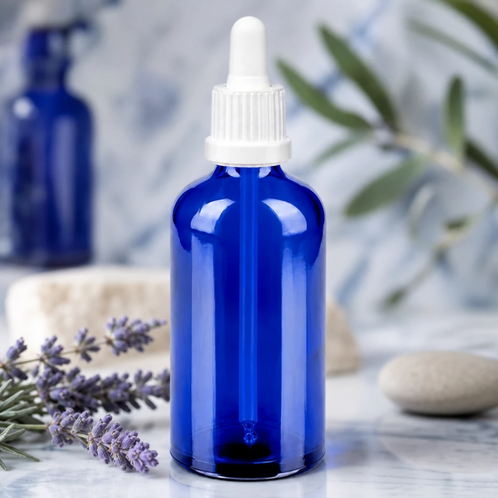 Elegant blå glasflaske 100 ml med ergonomisk BlueLine UT18/100-pipette for nem håndtering