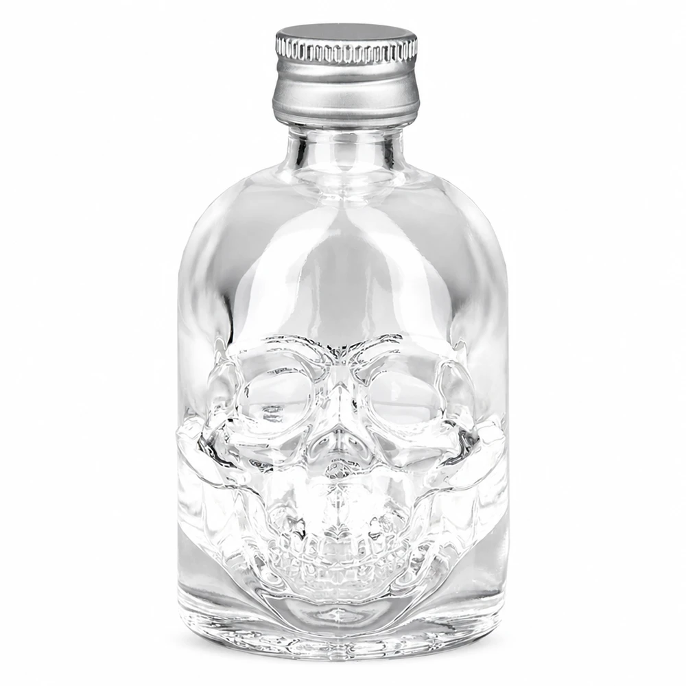 50 ml glasflaske »Hector« og skruelåg sølv UNiTWIST® 50 ml Hector-glasflaske med kranierelief og sølvfarvet UNiTWIS-skruelåg på hvid baggrund