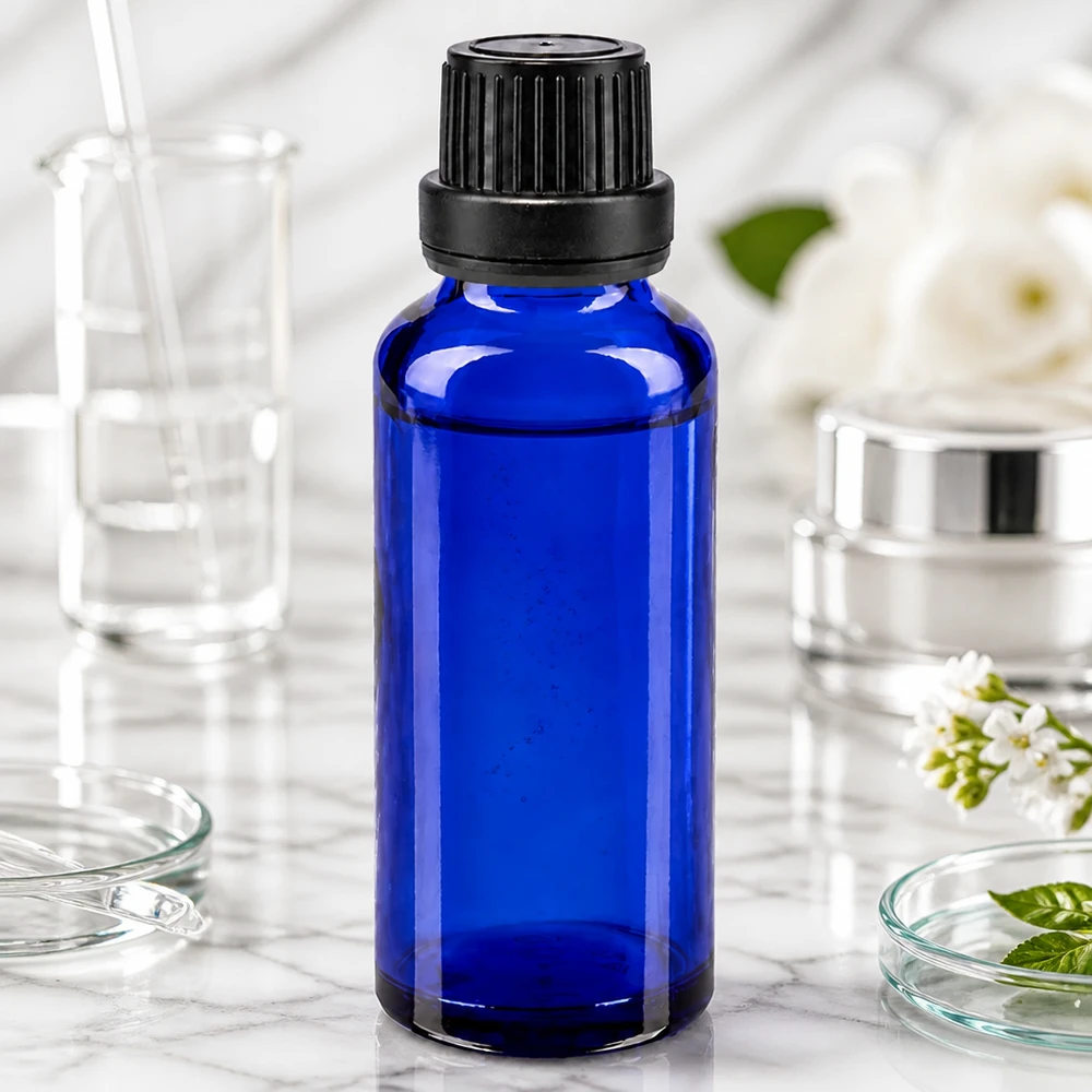 Apoteksflaske blå 30 ml skruelåg sort tæt OV Mørkeblå 30 ml dråbeflaske af apotekerglas med børnesikret skruelåg (11 mm)