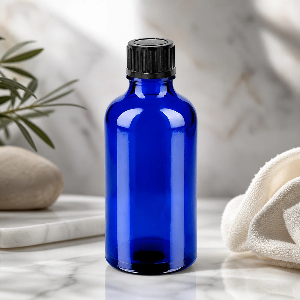 Kompakt 50 ml glasflaske i elegant koboltblå, ideel til serum og essenser