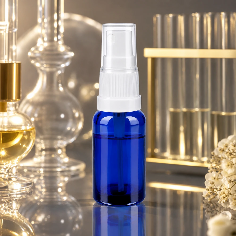 20 ml sprayflaske hvid/tr. STD BlueLine UT18/20 Kompakt 20 ml sprayflaske i blåt glas af høj kvalitet med ergonomisk hvid spraytilslutning