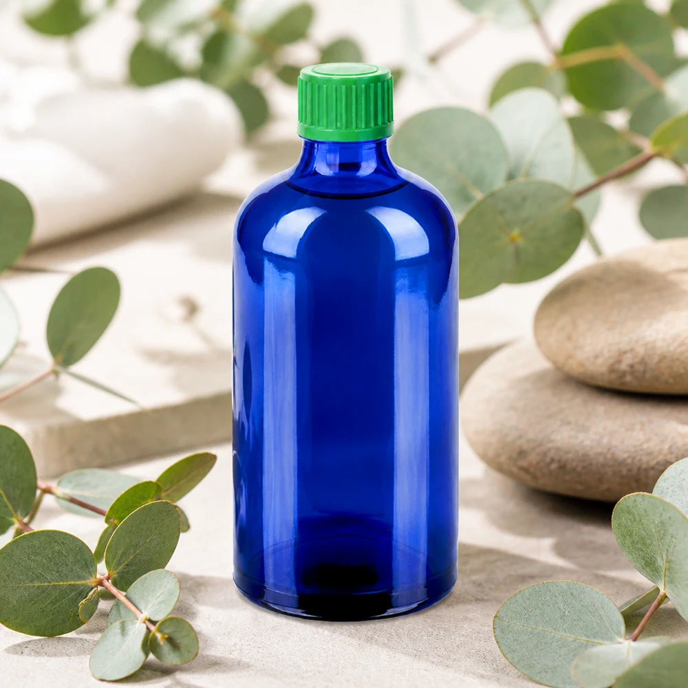 Blå glasflaske 100 ml med standard dråbehætte til æteriske olier og tinkturer