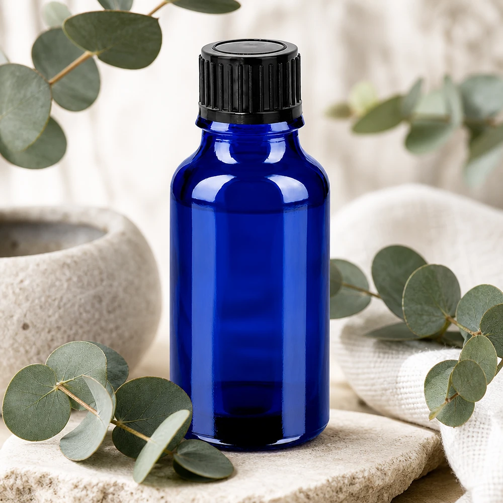 Robust 20 ml glasflaske i elegant koboltblå med praktisk 11 mm skruelåg