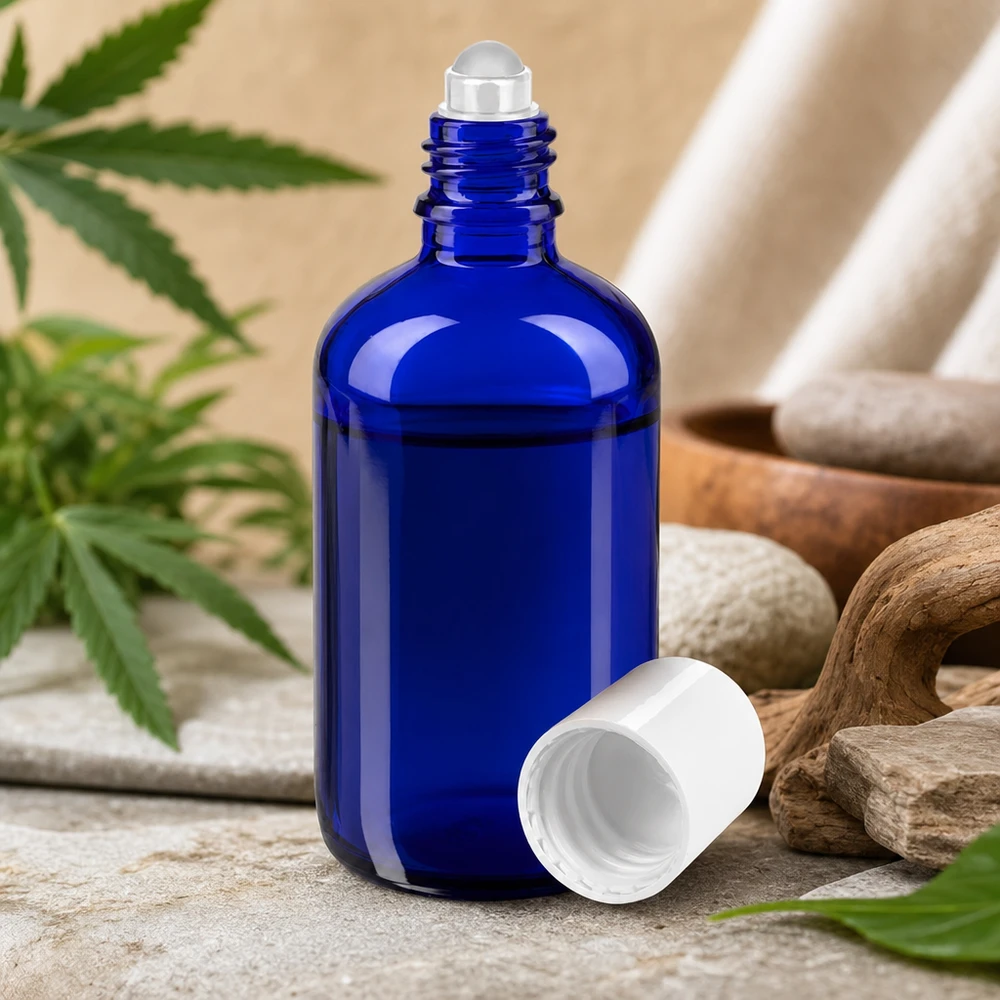 Apoteksflaske blå 100 ml roll-on-hætte hvid Blå 100 ml apotekerflaske med rullehoved, natursten og cannabisblade