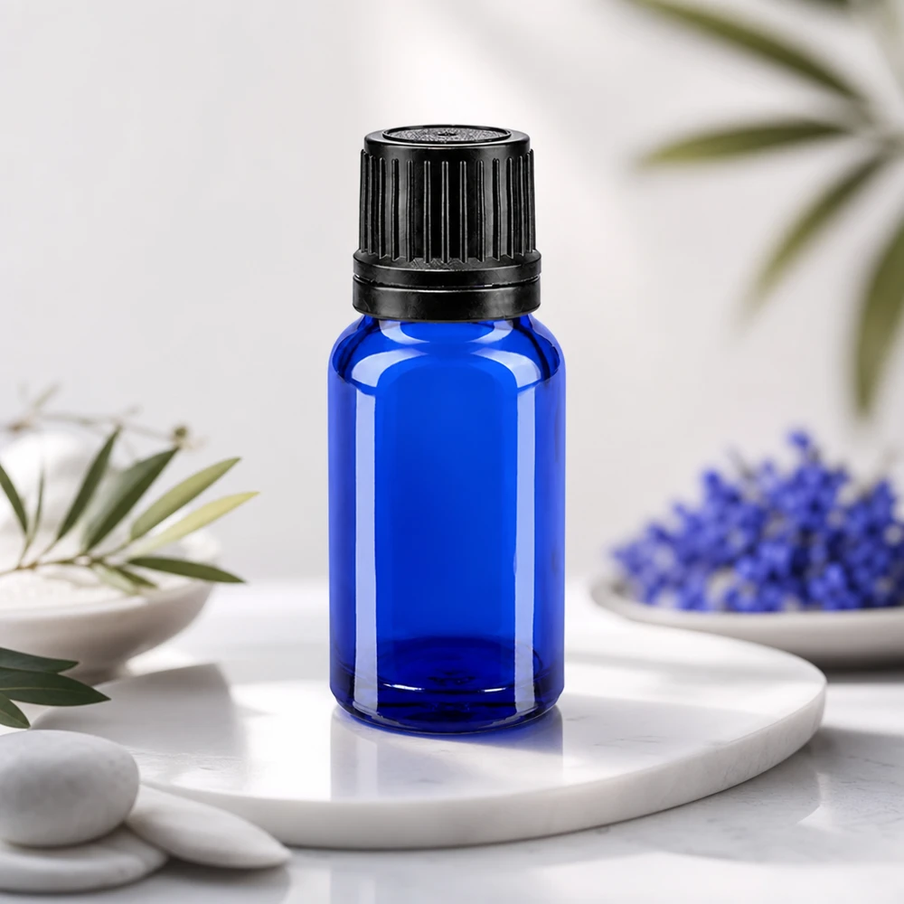 Blauglas-dråbeflaske, 10 ml, med sort OV-sikkerhedslåg og præcis 1 mm doseringsindsats