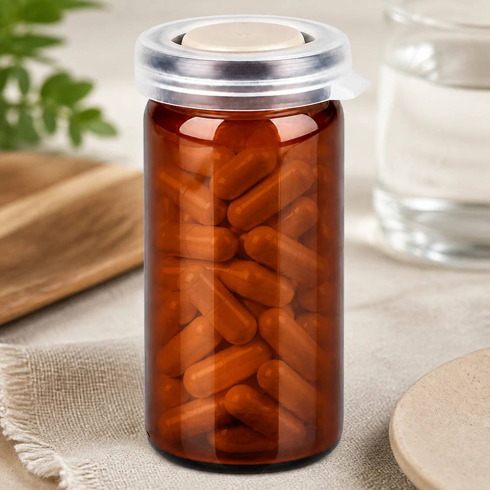 Apotekglas på 10 ml i brunt glas med kliklåg, fyldt med brune kapsler