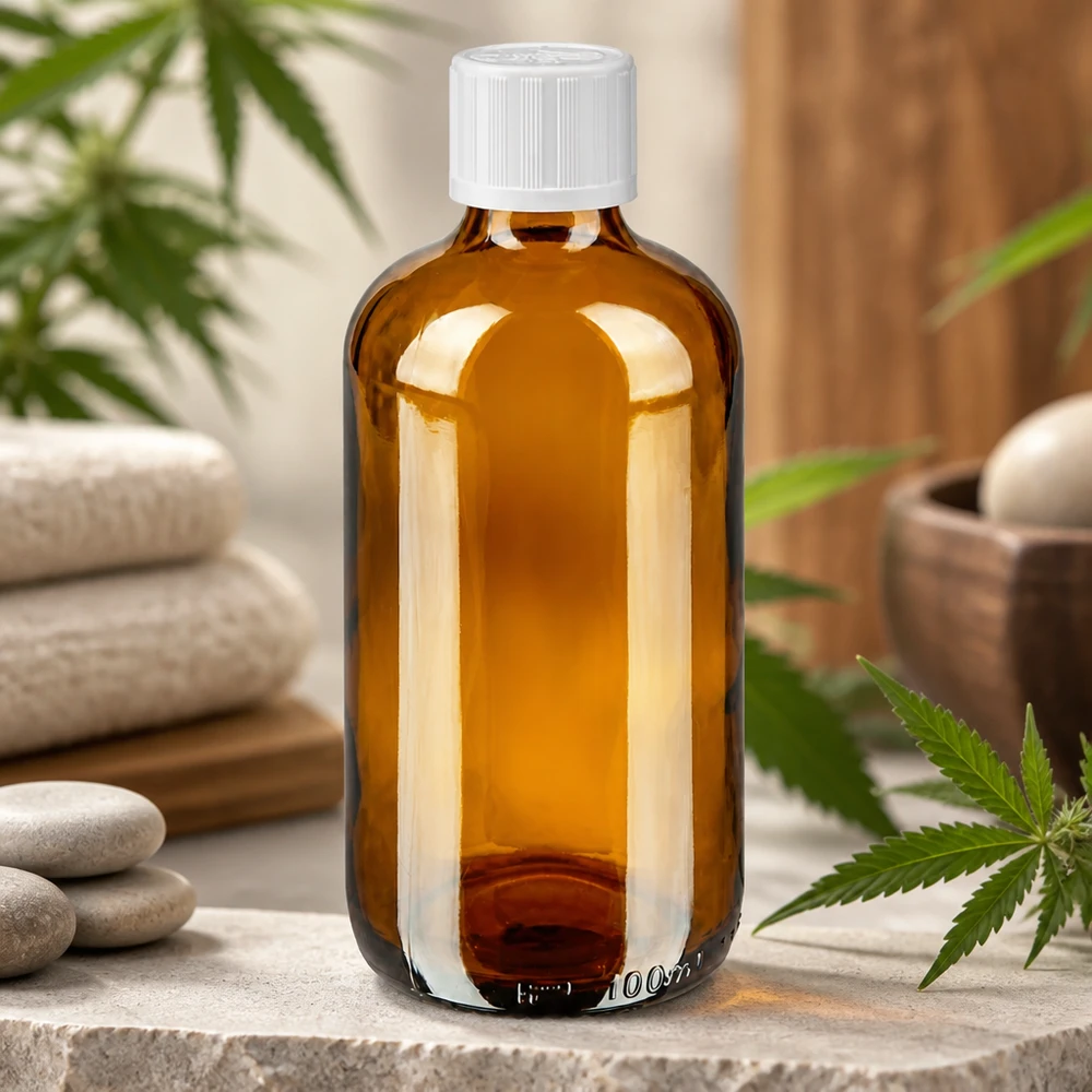 Apoteksflaske brun 100ml dråbetæller hvid KiSi St 100 ml apotekerflaske af brunt glas med hvidt KiSi-låg med motiv af cannabisblade og wellness-sten