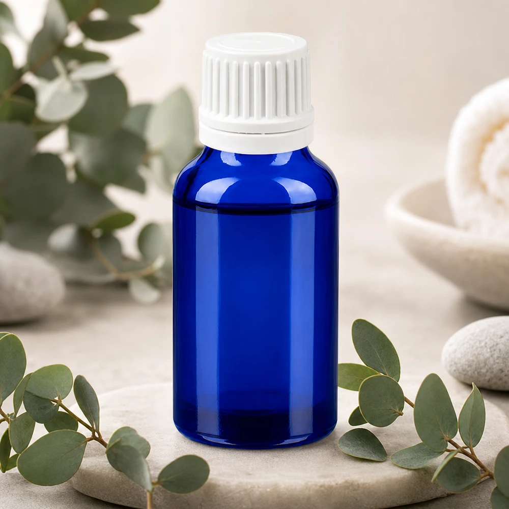 20 ml SV-glasflaske, blå, med hvidt låg til sikker opbevaring af produktet.