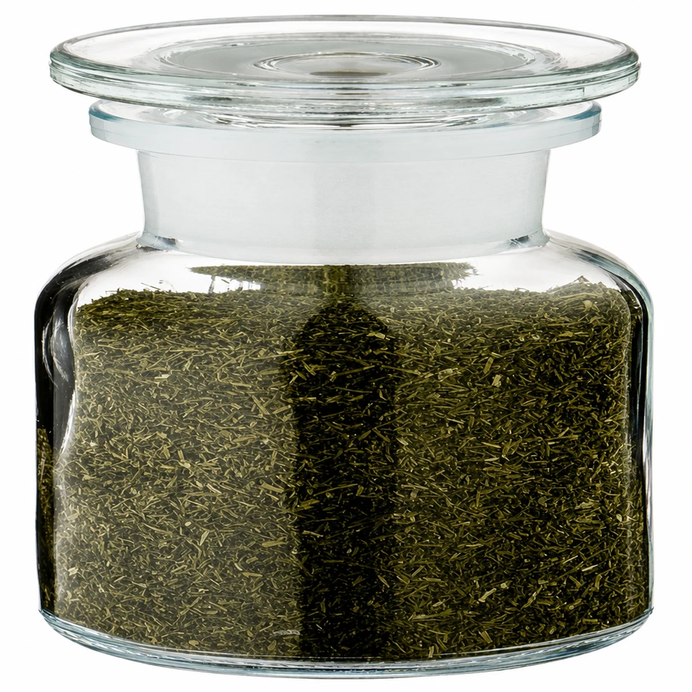 Apotekerflaske, 100 ml, bred hals, klart glas, fyldt med grøn urtete og med glaslåg
