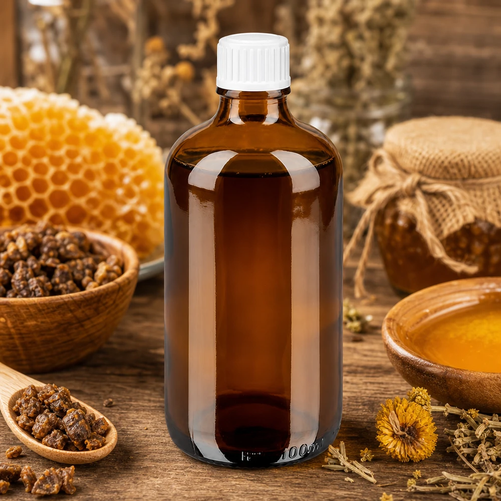 100 ml apotekerflaske af ravfarvet glas med hvid skruelåg, mellem honningkager og propolis