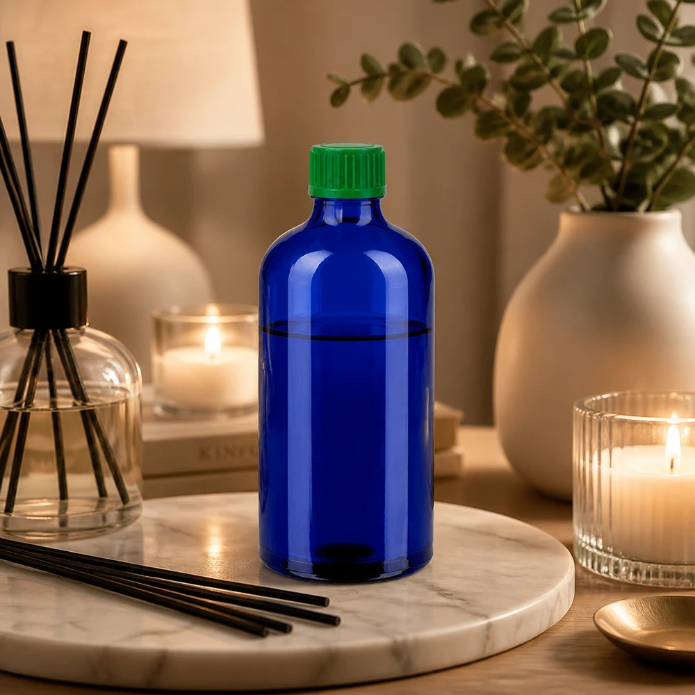 Blå dråbeflaske 100 ml af høj kvalitet lavet af glas med grøn plasthætte til sikker opbevaring