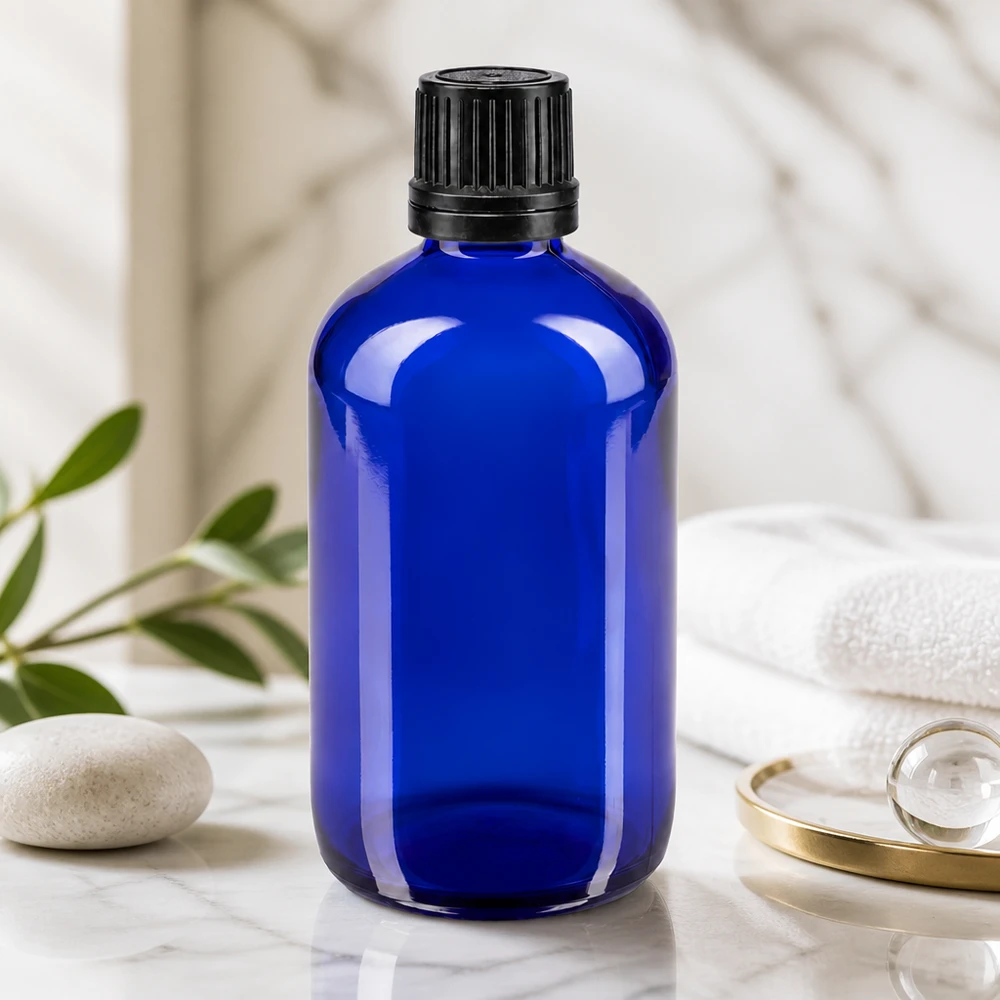 Koboltblå 100 ml apotekerflaske GR med sort 8 mm originalprop af UV-beskyttende glas