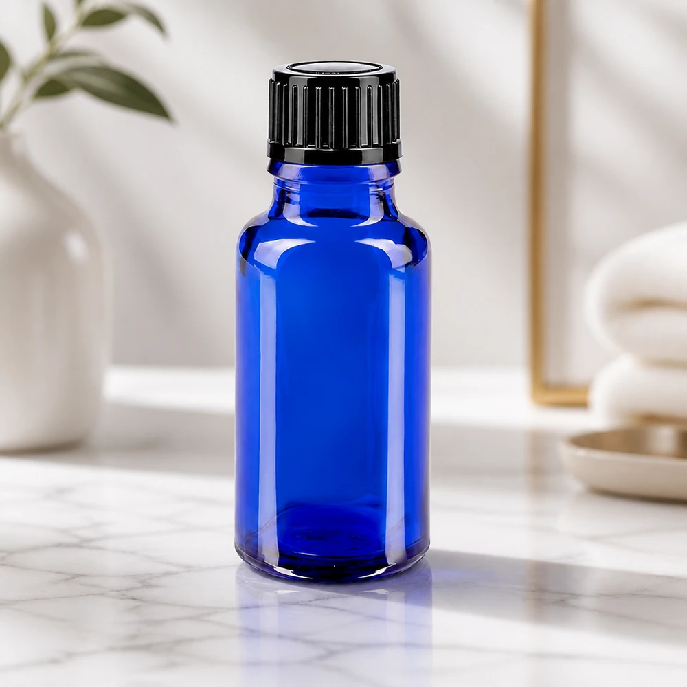 Apoteksflaske blå 20ml dryp v. 1mm sort pc Lille blå dråbeflaske på 20 ml af apotekerglas med sort skruelåg