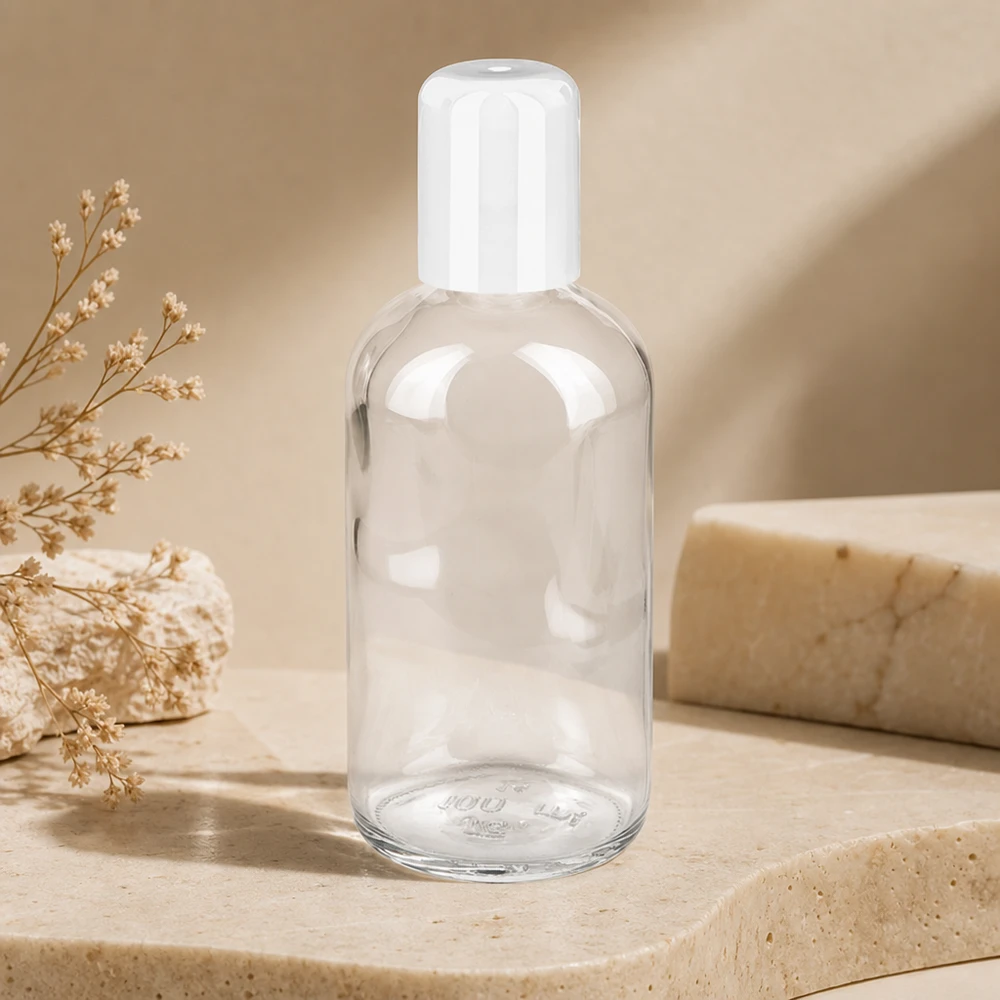100 ml roll-on flaske hvid STD ClearLine UT18/100 Tom 100 ml ClearLine-roll-on-flaske med flip-top-låg i hvid på natursten