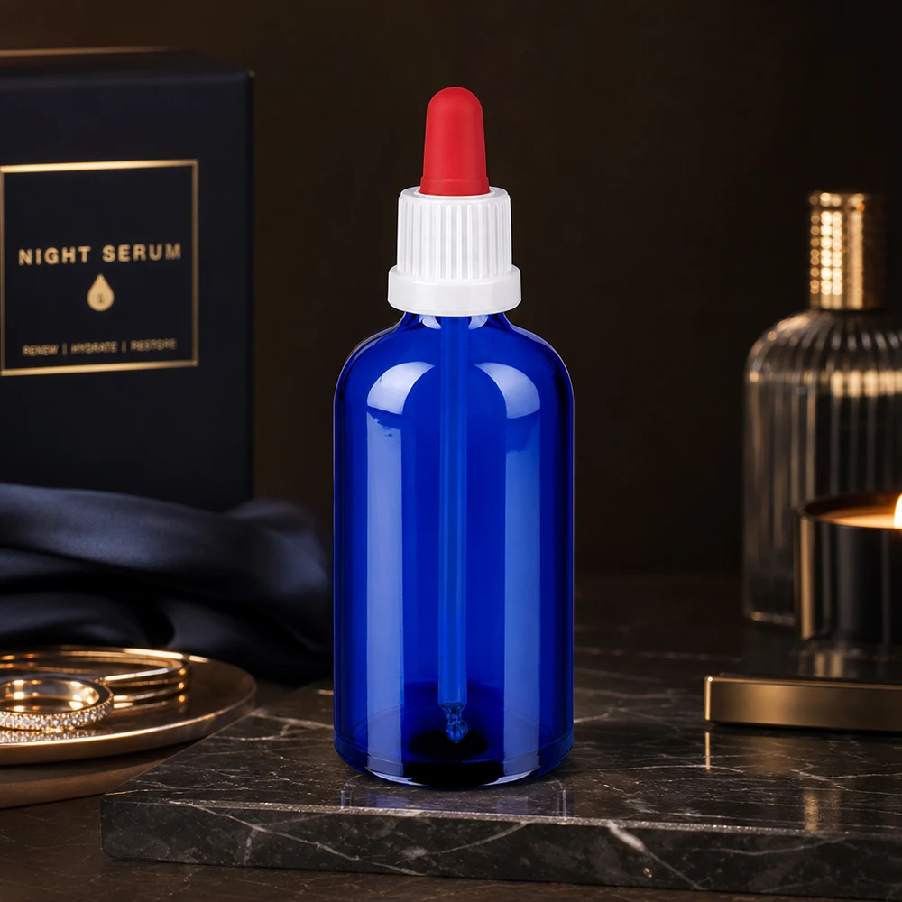 Lysbeskyttelsesglasflaske 100 ml i koboltblå med pipettehætte til lysfølsomme stoffer
