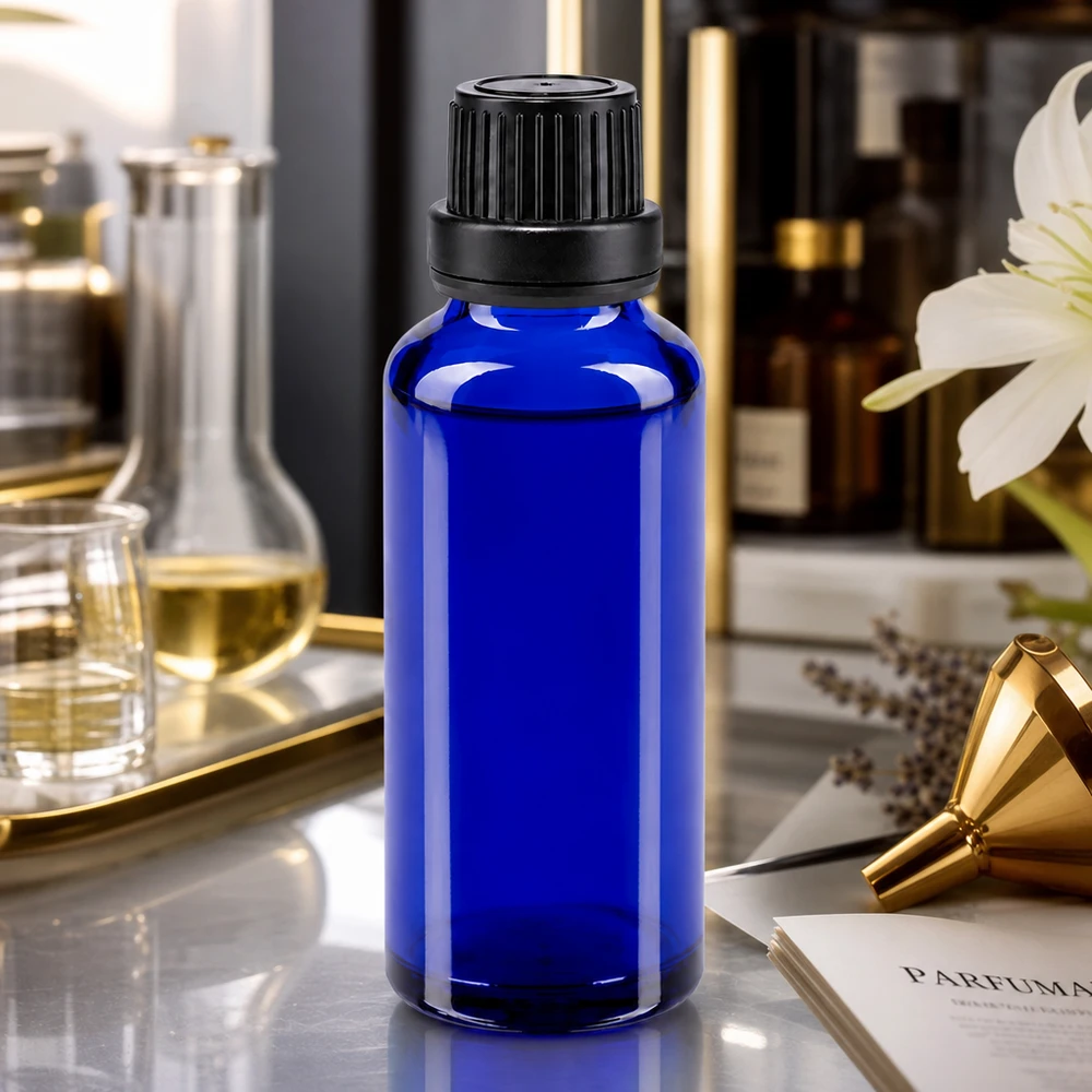Blå 30 ml ApoGlas-dråbeflaske med 2 mm indsats og sort låg til fremstilling af parfume