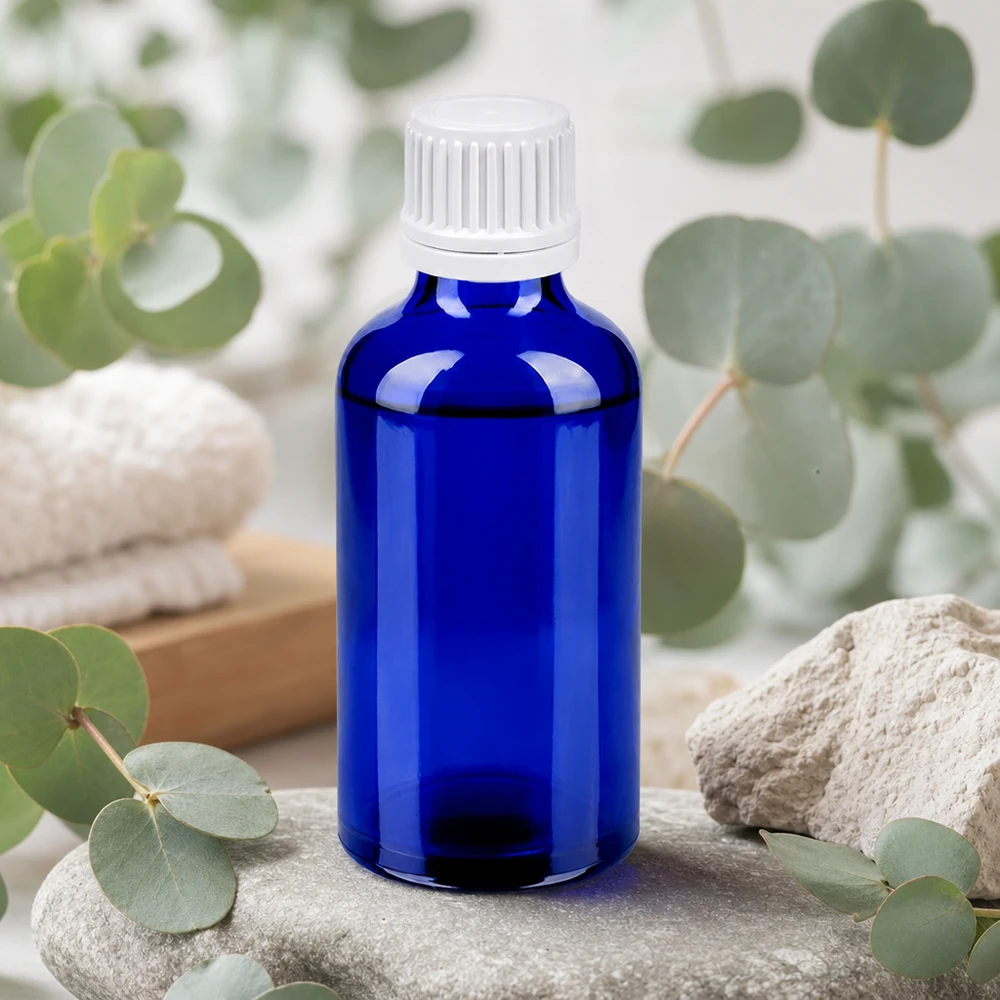 Kompakt 50 ml glasflaske med 11 mm gevind i elegant blå til aromaterapi.