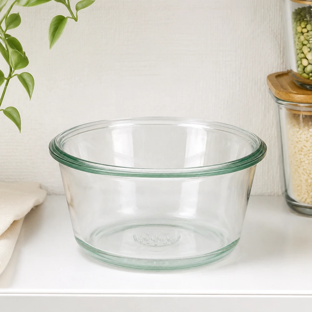 290 ml gourmetglas WECK RR100 WECK RR100 290 ml gourmetkrukke tom på hvid køkkenbordplade ved siden af opbevaringskrukker og grøn plante